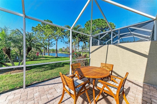 unfurnished sunroom featuring a water view