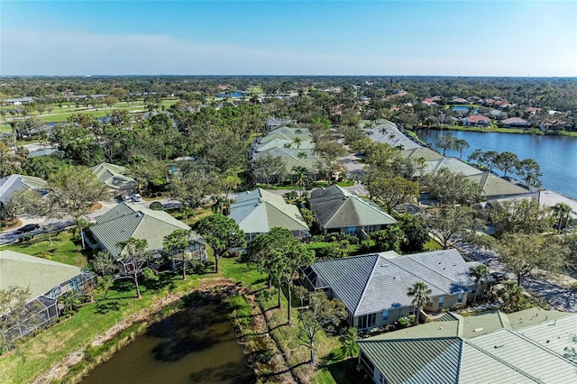 birds eye view of property featuring a water view and a residential view