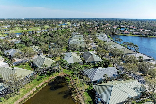 bird's eye view with a residential view and a water view