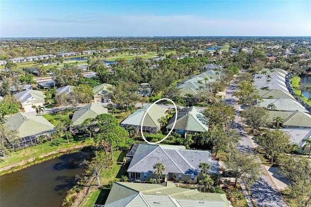 bird's eye view with a residential view and a water view