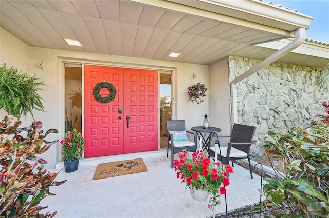 property entrance featuring stucco siding