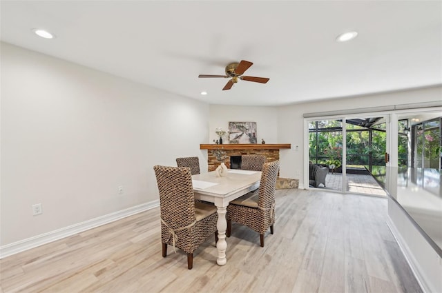 dining area featuring recessed lighting, baseboards, and light wood finished floors