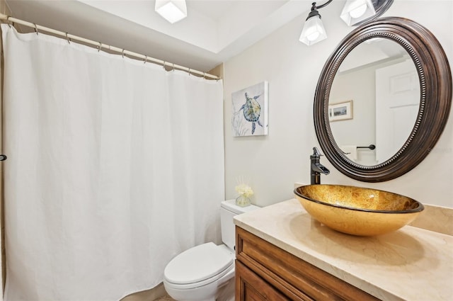 bathroom featuring toilet and vanity