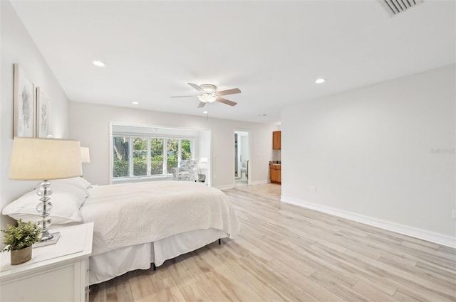 bedroom with ceiling fan, recessed lighting, visible vents, baseboards, and light wood finished floors