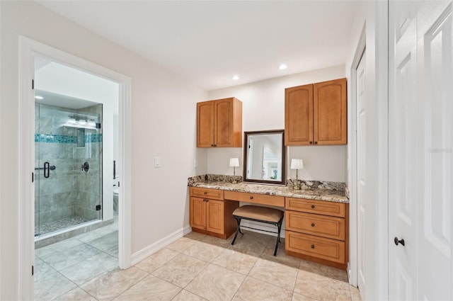 office area featuring recessed lighting, light tile patterned flooring, built in desk, and baseboards