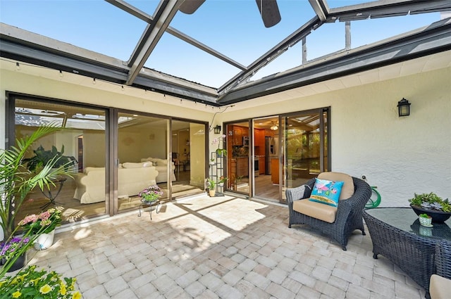 view of patio featuring a lanai