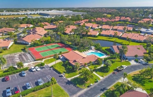 birds eye view of property featuring a residential view and a water view