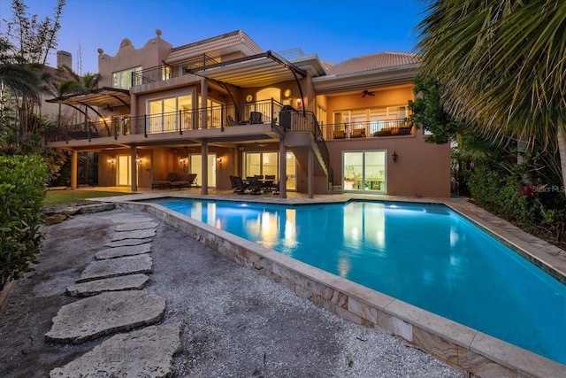 1364 Point Crisp Rd, Sarasota, FL 34242 - rear view of property with a patio area, a balcony, stucco siding, and a ceiling fan