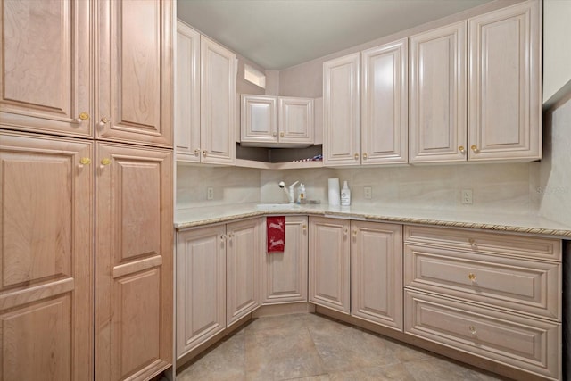 1364 Point Crisp Rd, Sarasota, FL 34242 - kitchen with a sink and light stone countertops