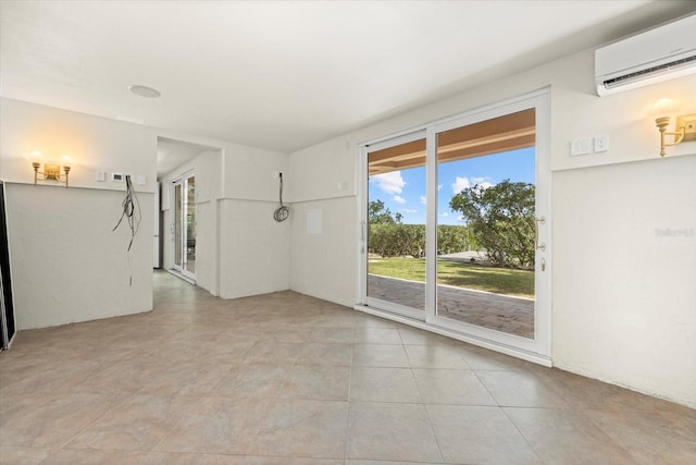 1364 Point Crisp Rd, Sarasota, FL 34242 - spare room featuring light tile patterned floors and a wall mounted air conditioner