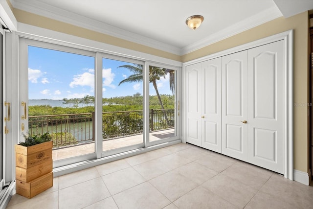 1364 Point Crisp Rd, Sarasota, FL 34242 - interior space featuring a water view, light tile patterned floors, and crown molding