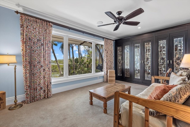 1364 Point Crisp Rd, Sarasota, FL 34242 - living area with crown molding, ceiling fan, baseboards, and carpet