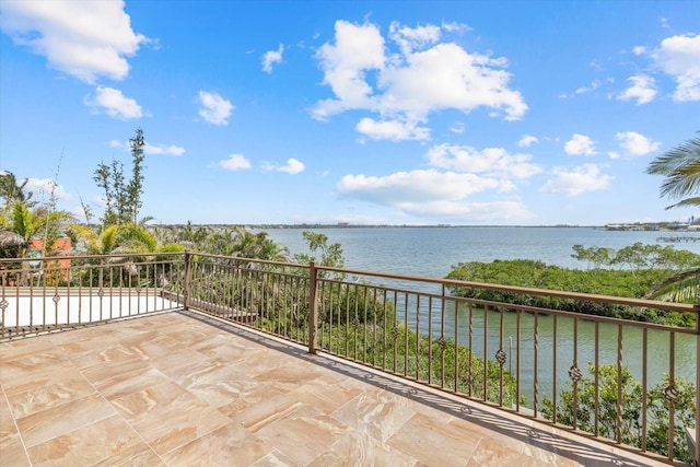 1364 Point Crisp Rd, Sarasota, FL 34242 - view of patio featuring a balcony and a water view