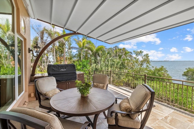 1364 Point Crisp Rd, Sarasota, FL 34242 - sunroom featuring a water view and outdoor dining area