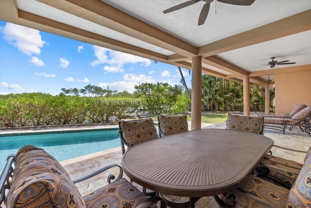 1364 Point Crisp Rd, Sarasota, FL 34242 - view of patio featuring an outdoor pool, outdoor dining area, and a ceiling fan