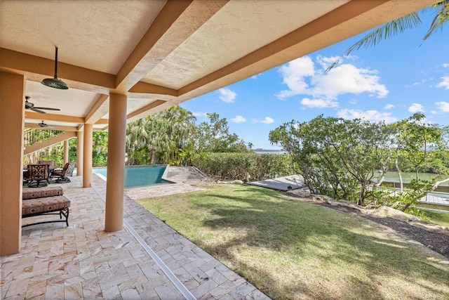 1364 Point Crisp Rd, Sarasota, FL 34242 - view of yard with a patio area, an outdoor pool, and a ceiling fan