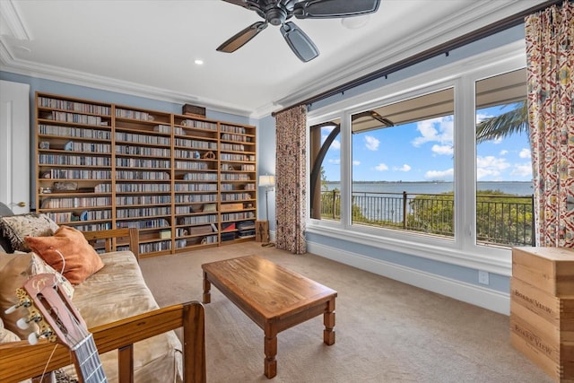 1364 Point Crisp Rd, Sarasota, FL 34242 - sitting room with crown molding, ceiling fan, baseboards, and carpet