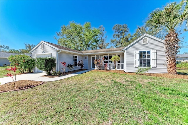 single story home with a garage, covered porch, driveway, and a front lawn