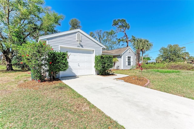 ranch-style home with a garage, driveway, and a front lawn