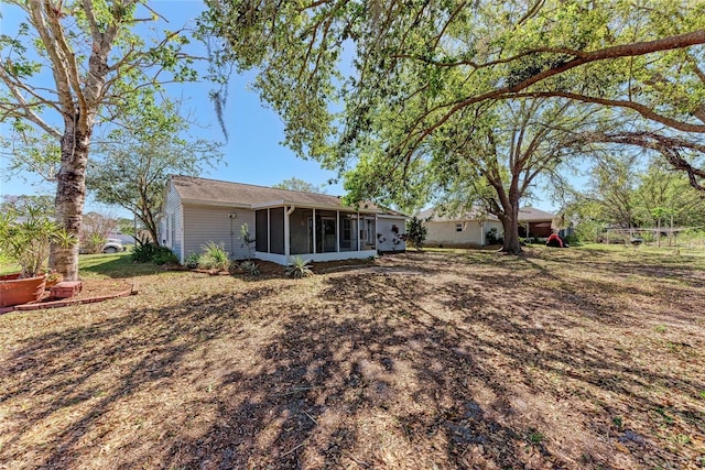 rear view of house with a sunroom