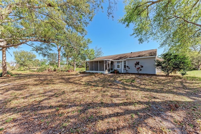 back of house with a sunroom