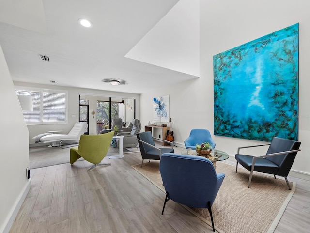 interior space featuring visible vents, baseboards, and wood finished floors