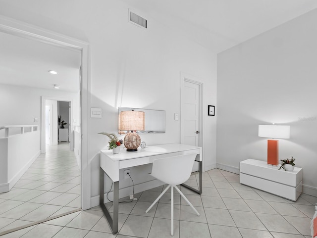 office area with light tile patterned floors, visible vents, and baseboards