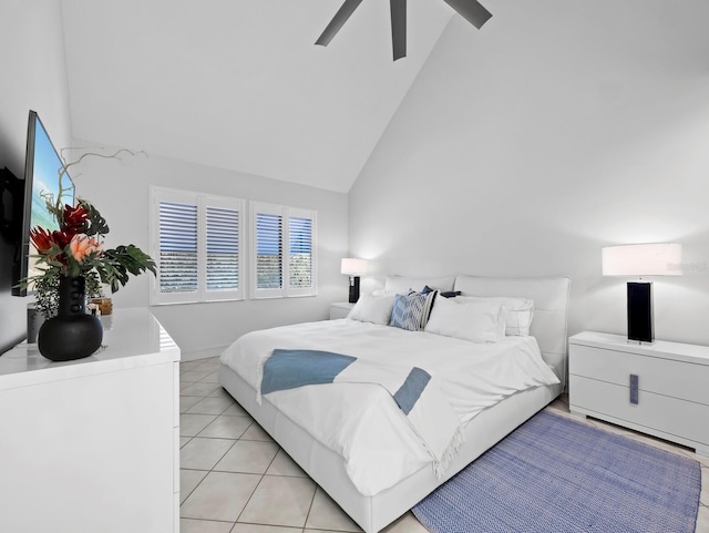 bedroom featuring light tile patterned floors, high vaulted ceiling, and ceiling fan