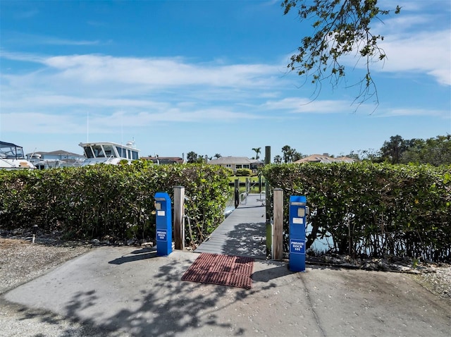 view of home's community featuring a boat dock