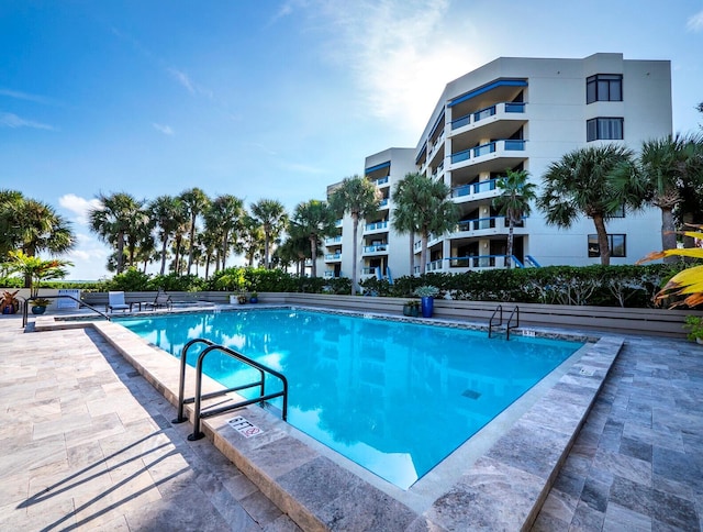 pool with a patio area