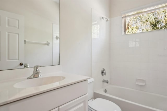 bathroom with shower / bathing tub combination, vanity, and toilet