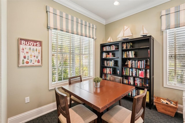 dining room with ornamental molding, dark wood-type flooring, and baseboards