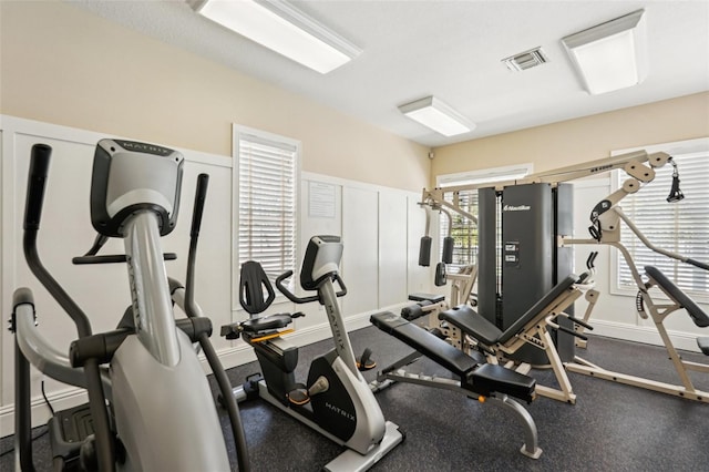 workout area with visible vents and baseboards