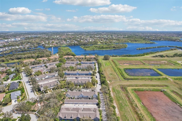 drone / aerial view featuring a water view and a residential view