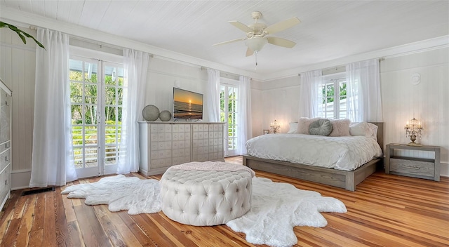 7715 Westmoreland Dr, Sarasota, FL 34243 - bedroom featuring visible vents, multiple windows, hardwood / wood-style floors, and ornamental molding