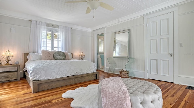 7715 Westmoreland Dr, Sarasota, FL 34243 - bedroom featuring crown molding, ceiling fan, and wood finished floors