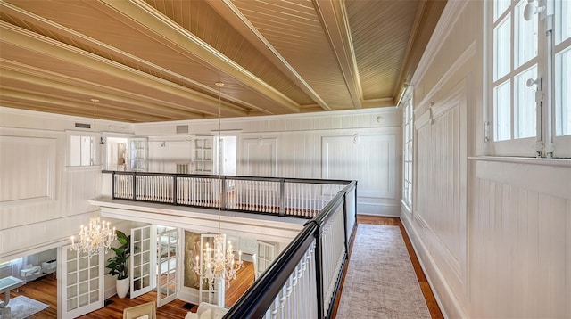 7715 Westmoreland Dr, Sarasota, FL 34243 - hall featuring a chandelier and wood finished floors