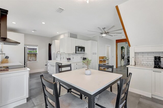 dining area featuring recessed lighting, visible vents, finished concrete flooring, and ceiling fan