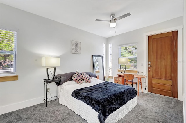 carpeted bedroom with baseboards and a ceiling fan