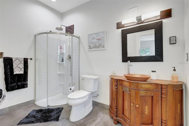 bathroom featuring a shower stall, baseboards, toilet, and vanity