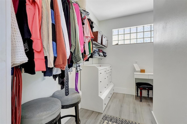 walk in closet featuring light wood-style flooring
