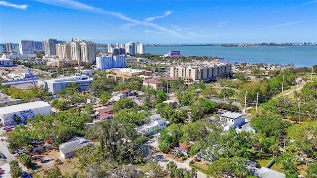 aerial view featuring a city view and a water view