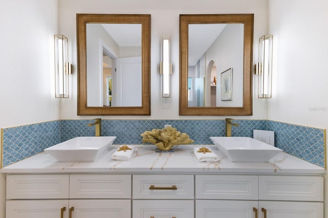 bathroom featuring double vanity and a sink