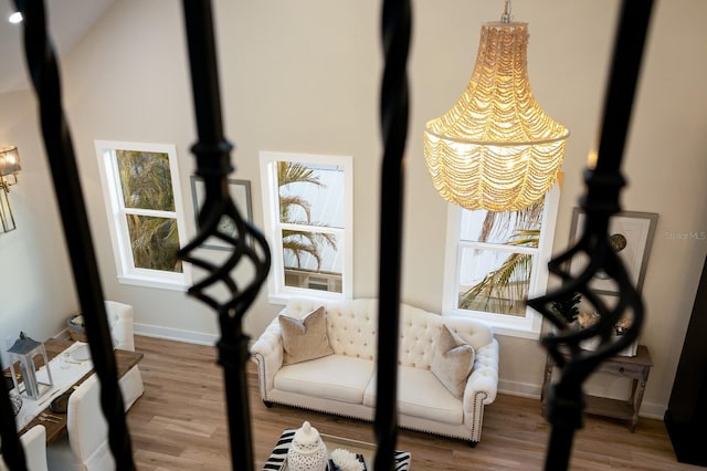 exercise room featuring wood finished floors and baseboards