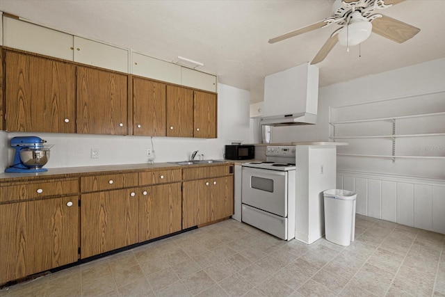 kitchen with black microwave, white electric range, and brown cabinets