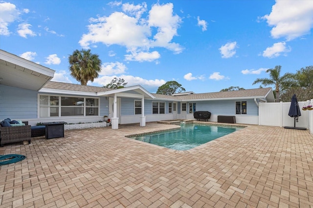 view of swimming pool with central air condition unit, fence, a grill, a fenced in pool, and a patio area