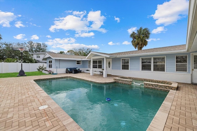 view of swimming pool featuring fence, a fenced in pool, and a patio