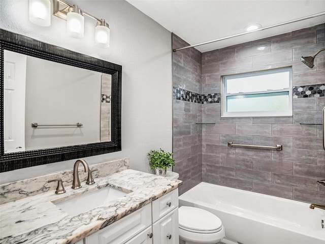 bathroom with vanity, toilet, and tub / shower combination