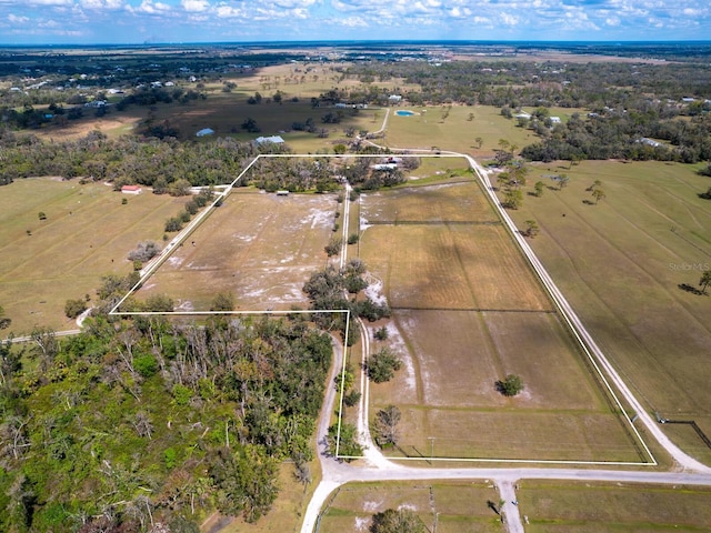 birds eye view of property featuring a rural view