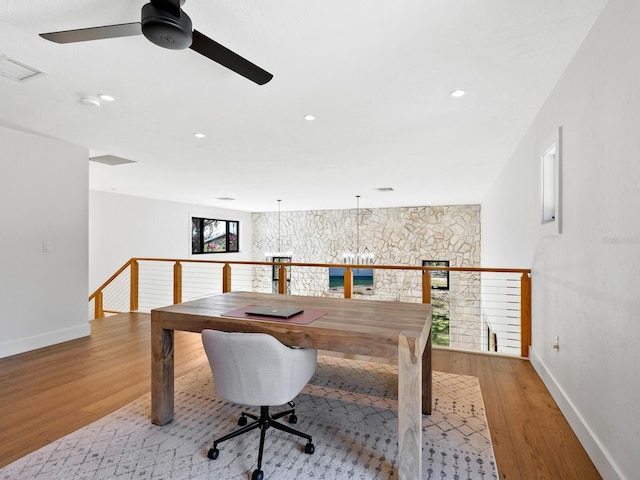 office space with baseboards, wood finished floors, visible vents, and recessed lighting